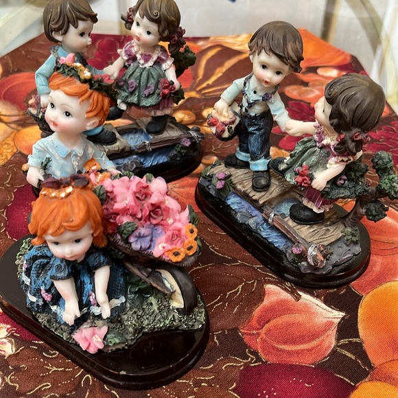 Other - Bundle of ceramic cherubs figurines with floral scenery.